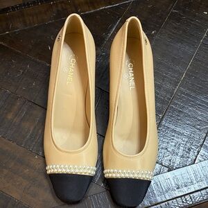 Black and beige with pearl heeled pumps